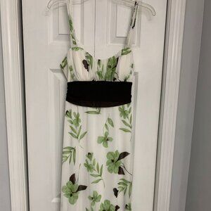 Extraordinary white dress with brown sash and green flowers.  sheer at bottom